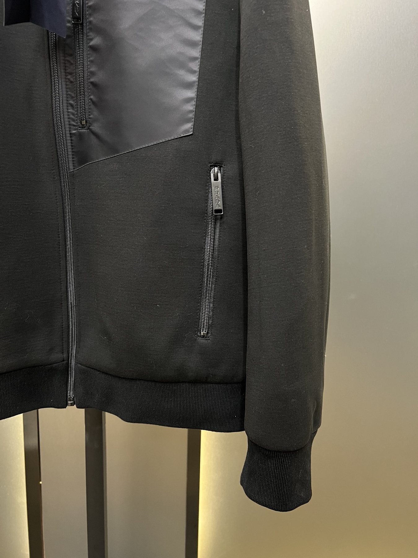 Prada Black Hooded Full-Zip Jacket with Triangle Chest Badge — detail