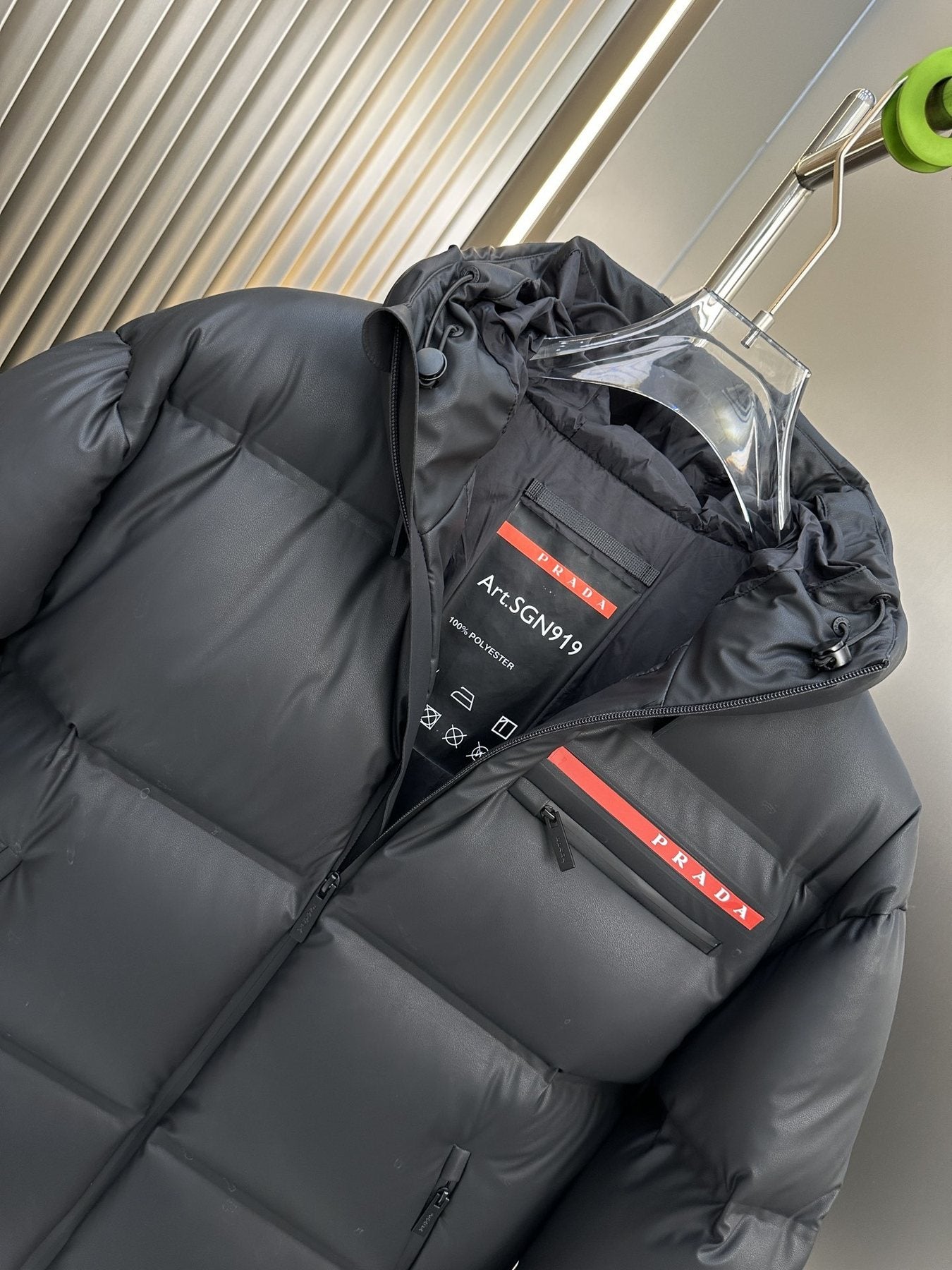 Prada Hooded Puffer Jacket with Red Chest Trim — detail